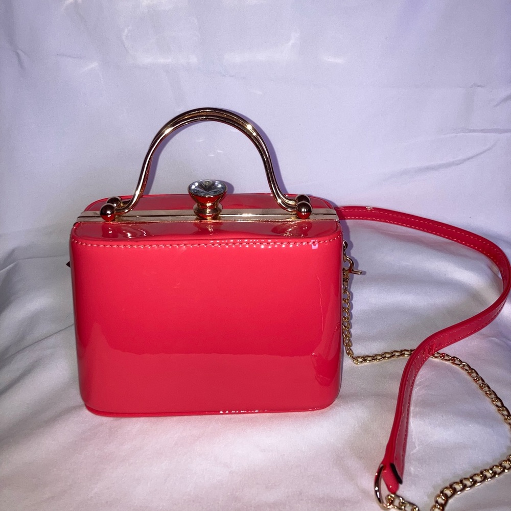 Coral pink hard shell purse